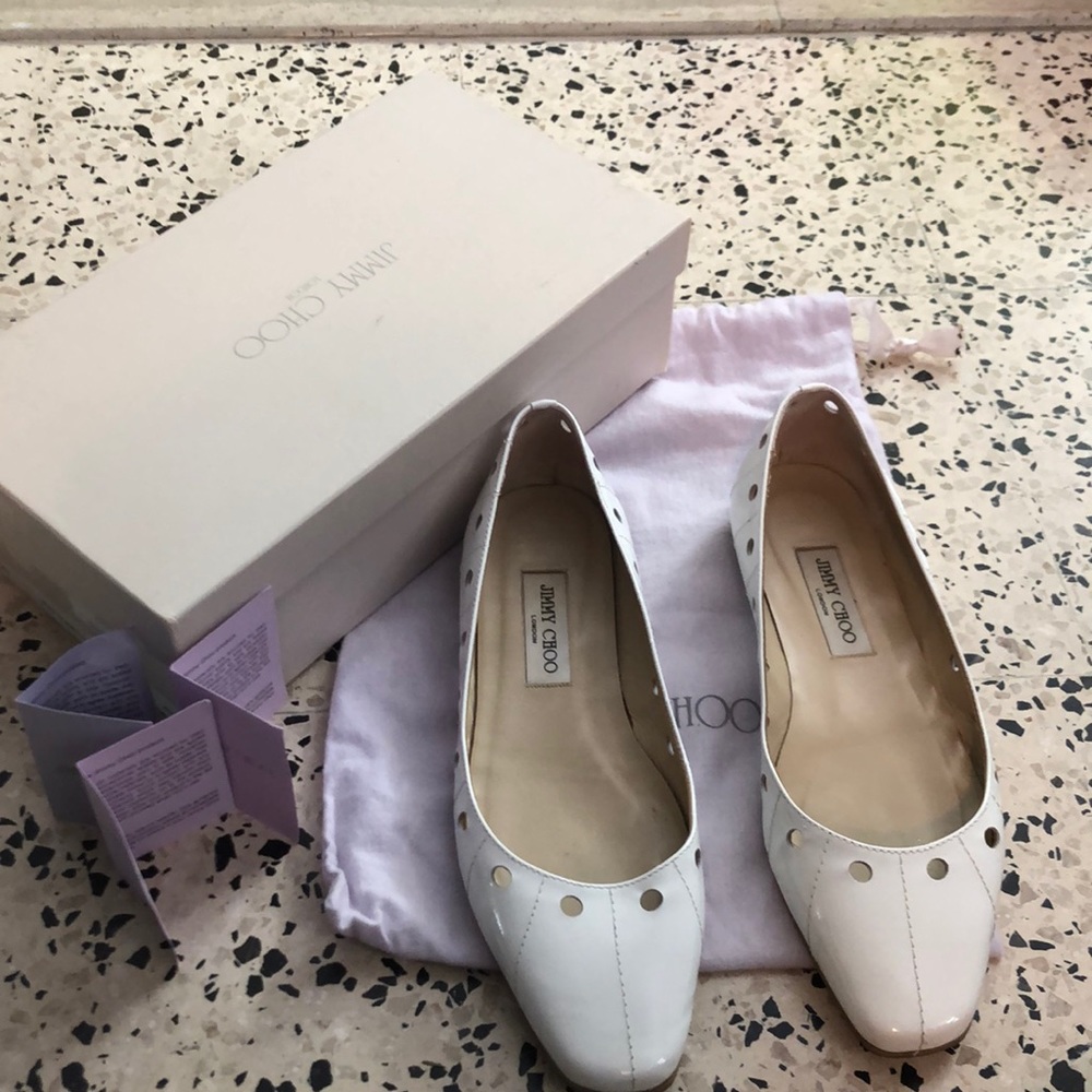 Jimmy Choo White patent leather flat shoe.